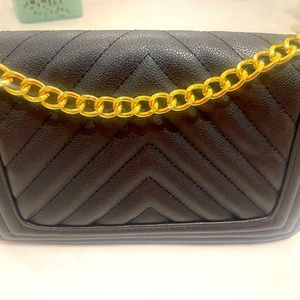 Black shoulder purse with adjustable gold chain strap